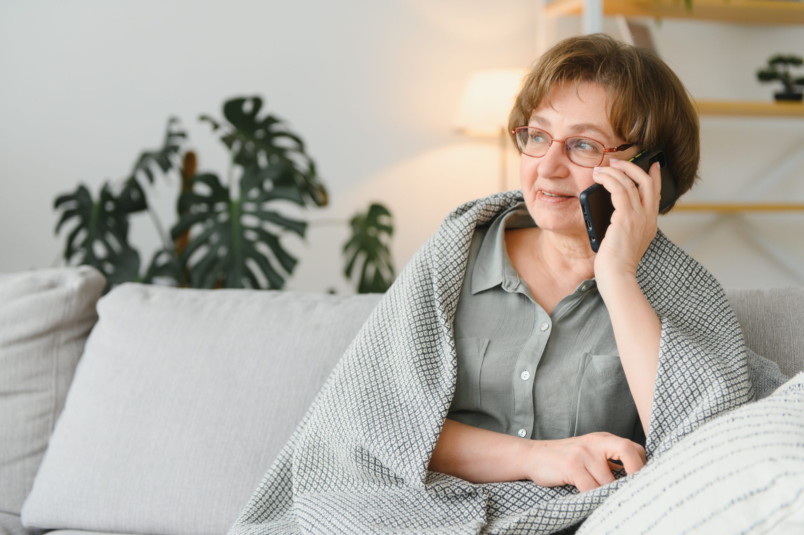 handsome-grandmother-talking-on-the-phone-at-home 7 Disability Benefits Mistakes That Cost People Their SSDI